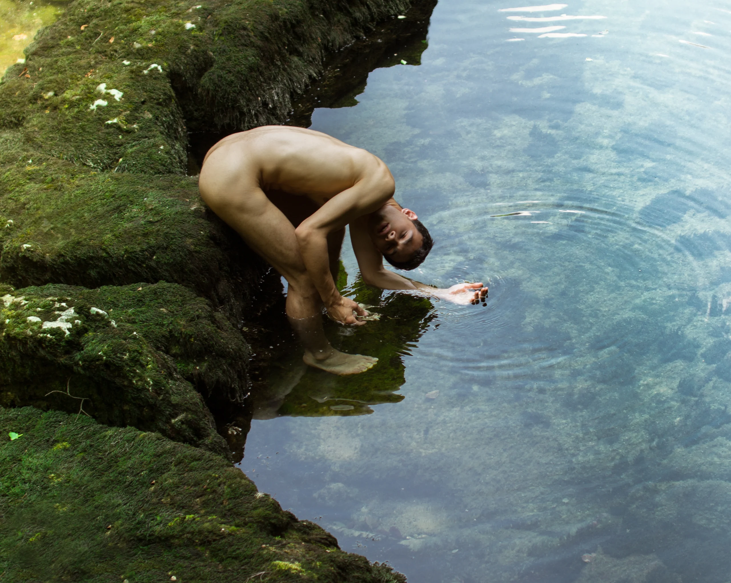 model Giuseppe Claudio posing on a lake